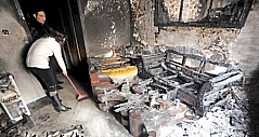 电烤炉用完未关 新买房子被大火烧成灰